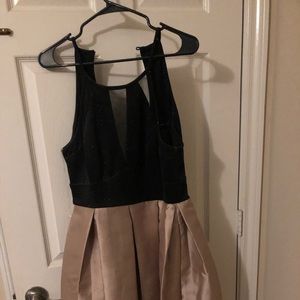 A black gold prom dress never been used